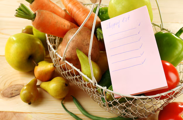 heap-fruits-vegetables-with-shopping-list-table-close-up_392895-399885
